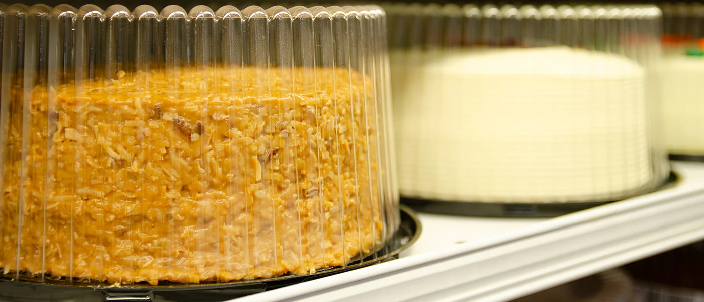 variety of cakes on a shelf at Fresh County Market